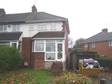 An end terrace property in need of some improvements briefly comprising lounge